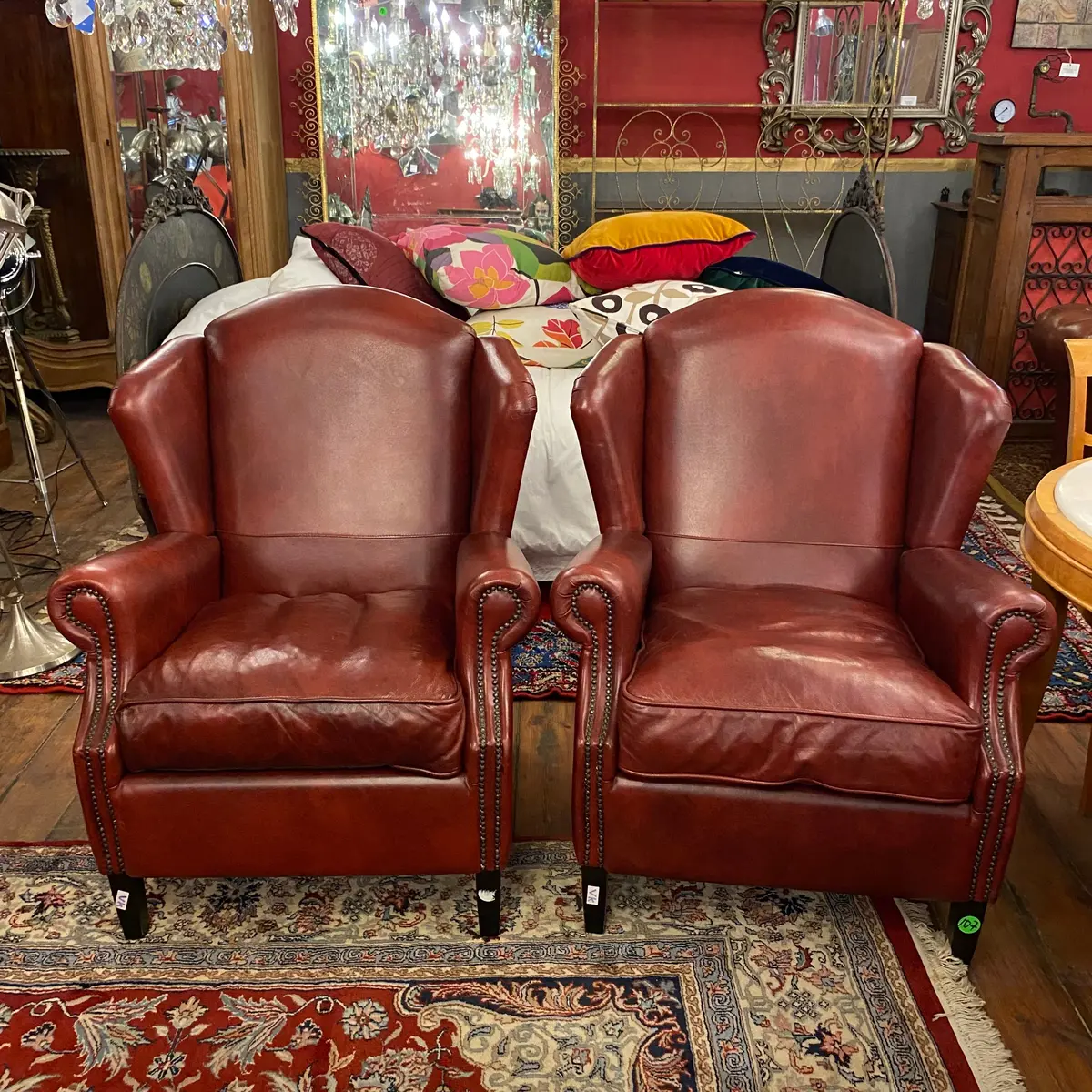 Pair Of Burgundy Leather Wingback Armchairs - Sold 1